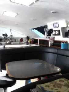 The saloon and galley inside the sailing catamaran Maria